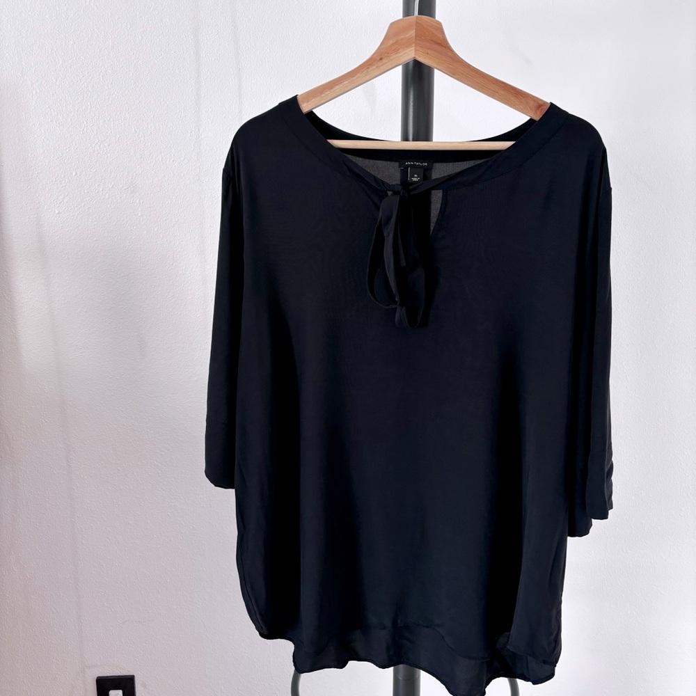 Black Ann Taylor blouse with a tie in the front.